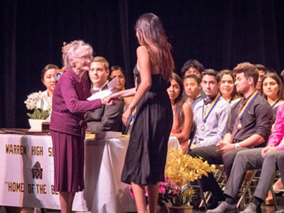 Image of a young woman receiving an award